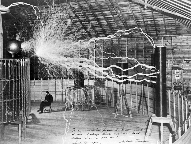 Tesla sitting in his Colorado Springs laboratory